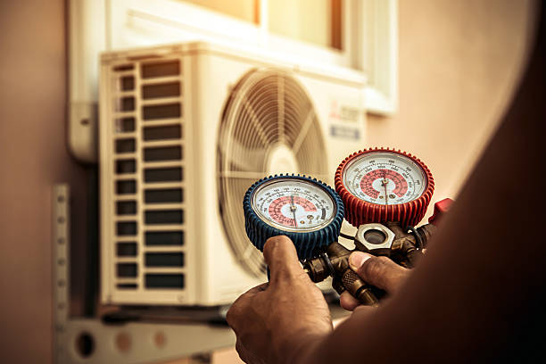 Professional Heat Pump Repair technician working in French Camp, MS